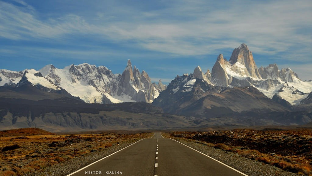 road leading to mountain peaks
